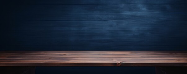 Abstract background with a dark indigo wall and wooden table top for product presentation, wood floor, minimal concept, low key studio shot - obrazy, fototapety, plakaty