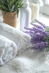 A bunch of towels sitting on top of a table. Perfect for household or hospitality concepts
