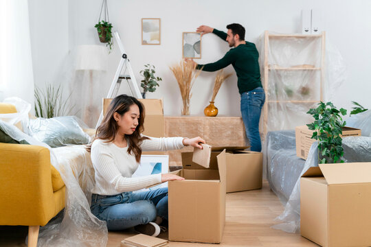 Couple organizing home during moving day.