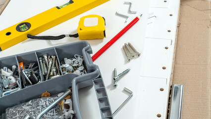 accessories for assembling furniture on a disassembled cabinet