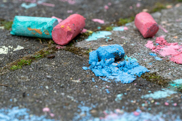 Crushed chalk pieces on pavement
