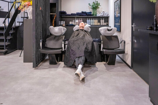 Person getting a hair wash at a salon