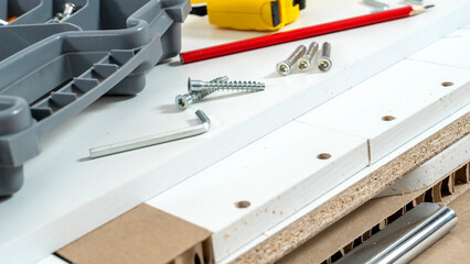 accessories for assembling furniture on a disassembled cabinet