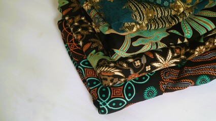 Batik textile with unique pattern from Indonesia,  textured multicolor fabric background