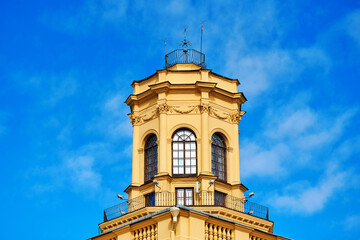 Octagonal three-tier belvedere against blue sky. Stalinist architecture. The building was built in 1945-1947. View on tower of historic building. Scenic view