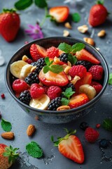A bowl of fruit and nuts on a table, perfect for healthy lifestyle concept