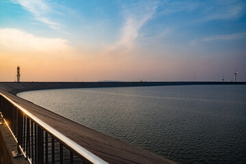 Fototapeta premium Photograph of a reservoir located on Khao Yai Thiang, Thailand, during the sunset time.