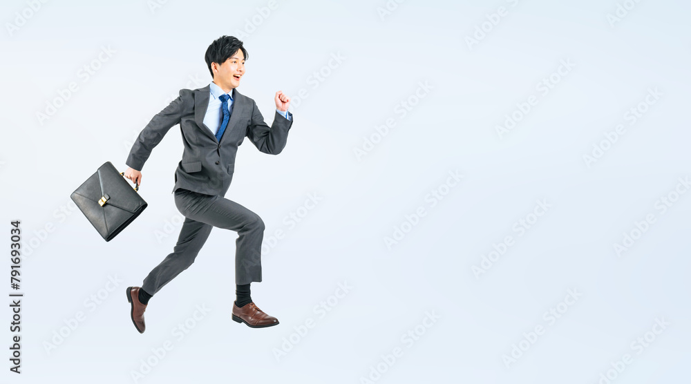 Aufkleber ジャンプする男性ビジネスパーソンの全身写真（切り抜き背景透過pngも販売しております。作成者リンクから「png」で検索してください）
