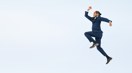 Fototapeta na wymiar Full body photo of a Black male business person jumping. (We also sell PNGs that are cropped and have transparent background. Please search for 