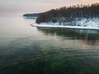 Drone photo of the steep coast of Estonia in the Baltic Sea in winter.