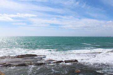 Fototapeta na wymiar waves on the sea, natural blue background, beautiful coast of the Mediterranean Sea in Alicante, Spain, 