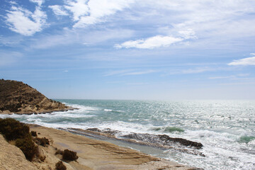 waves on the beach, natural blue background, beautiful Mediterranean coast in Alicante