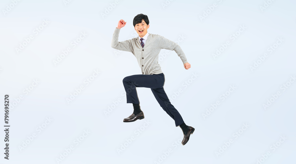 Aufkleber ジャンプする制服を着た男子学生の全身写真（切り抜き背景透過pngも販売しております。作成者リンクから「png」で検索してください）
