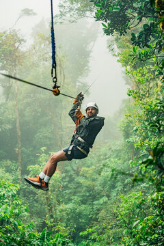 Adventurous zip lining experience in misty Costa Rican jungle
