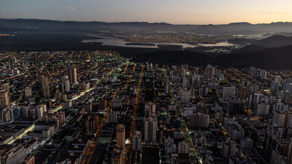 Drone footage - DAWN - BUILDINGS AND SAO VICENTE IN THE BACKGROUND, BRAZIL STATE OF SÃO PAULO, COAST