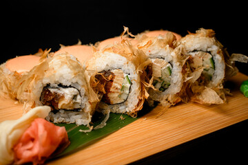 Delightful sushi on a wooden board with marinated ginger and wasabi - 791707046