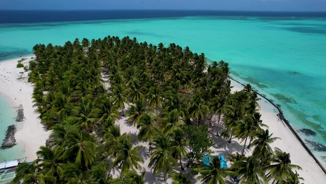 4K Aerial Drone video of beautiful tropical island Onok with white sand beaches, turtles, boats and turquoise blue water in Balabac, Philippines
