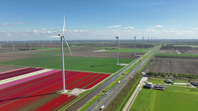 Fields and wind turbines. A wind generator on the  field. View from drone. Green energy production. Landscape from air at the day time. Photo for wallpaper and background. 