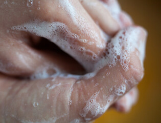 Washing hands. Rubbing with a soap.