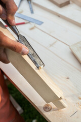 Working with chisel. Joiner's (carpenter's) tools.