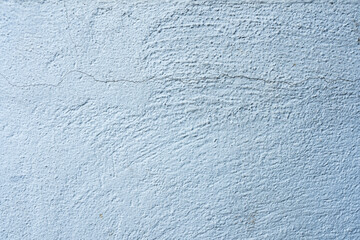 Blue and white textured wall background with rough surface pattern
