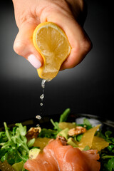 Salad of salmon, walnuts and orange with the addition of lemon juice - 791740664