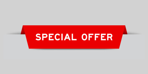 Red color inserted label with word special offer on gray background
