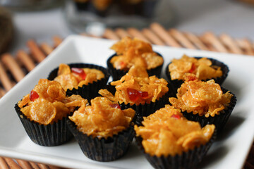 Honey Cornflakes (Cornflakes Madu) a popular cookies in Malaysia during celebration of Eid Mubarak (Hari Raya) on selective focus