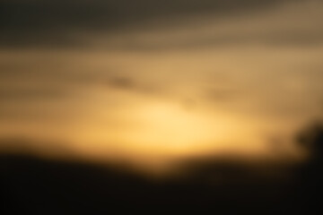 A blurry photo of a sunset with a hazy background