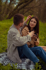 A man tenderly strokes the woman's hair, signifying romantic connection and friendship. First date...