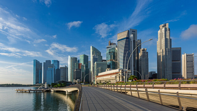 Panorama of Singapore skyline with Merlion statue fountain.