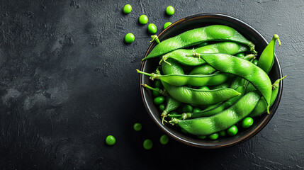 Green Edamame soybeans and green peas on dark rustic background. Healthy food cooking concept. Top view. - obrazy, fototapety, plakaty