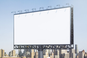 Fototapeta premium Blank white horizontal billboard on skyline background at daytime, perspective view. Mock up, advertising concept