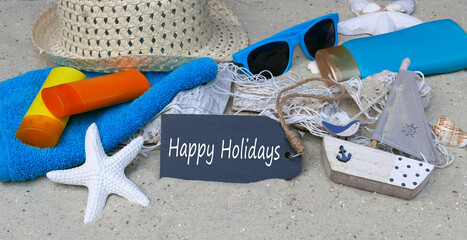 Greeting card Happy Holidays: chalkboard with beach accessories.
