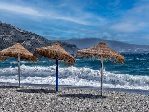 Straw Umbrellas on Beach