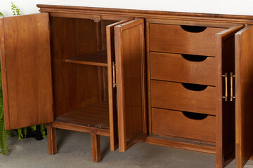 Unique vintage wooden credenza. Art Deco revival sideboard furniture piece. Close-up product...