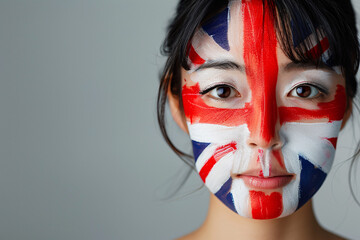 Young woman with British flag face paint soccer fan