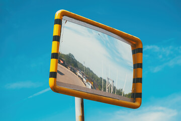 Old traffic mirror with yellow plastic frame - 791785234
