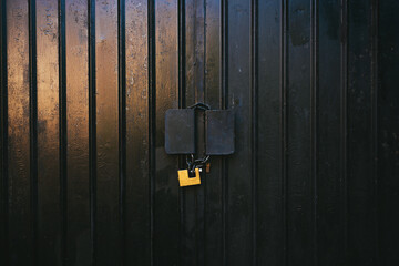 Black garage door with padlock