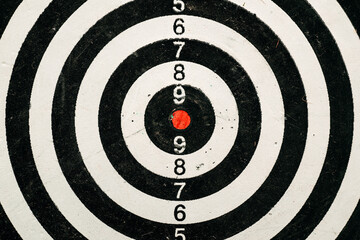 Dartboard target with red dot center close up - 791786031