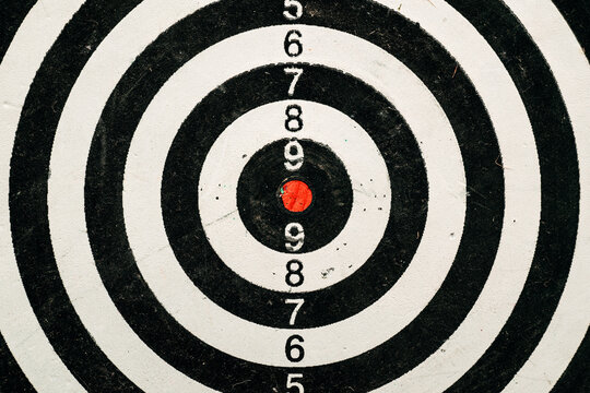 Dartboard target with red dot center close up