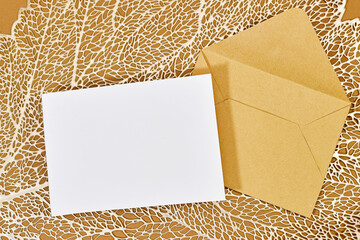 Blank greeting card, flyer or invitation card mockup and brown envelope with leaf plant, Valentines...