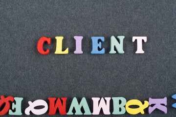 CLIENT word on black board background composed from colorful abc alphabet block wooden letters,...