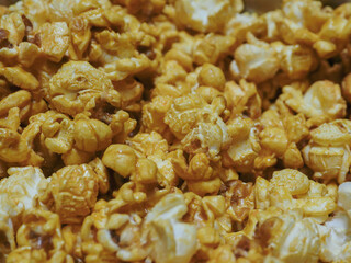 Delicious sweet popcorn, close-up shot for dessert food background. 