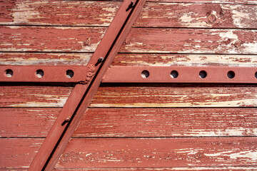 The wall of the railway carriage made of planks in close-up.
