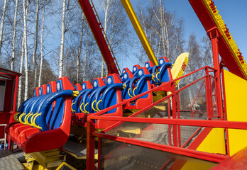 Empty seats on the attraction in close-up.