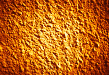 Orange bumpy painted wall texture background