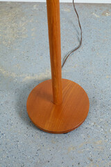 Beautiful vintage solid wood floor lamp. Interior product photograph, close-up of the base.