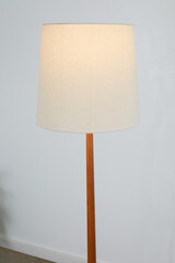 Beautiful vintage solid wood floor lamp. Interior product photograph.