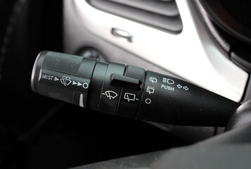 Car windshield wiper switch. Wipers switch control. Adjusting speed wipers in car. Wiper switch toggle. Automotive part concept. - obrazy, fototapety, plakaty